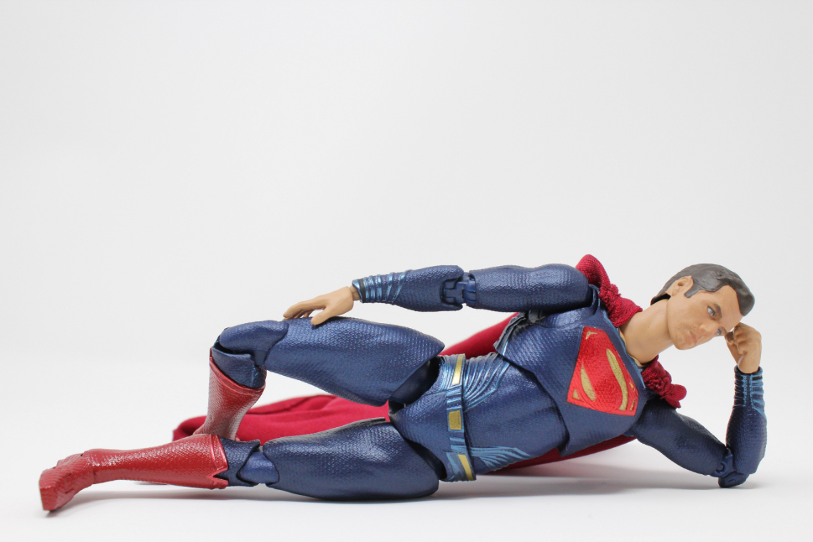 Superman lying down in a pose