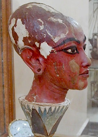 Tutankhamun’s head emerging from a lotus.