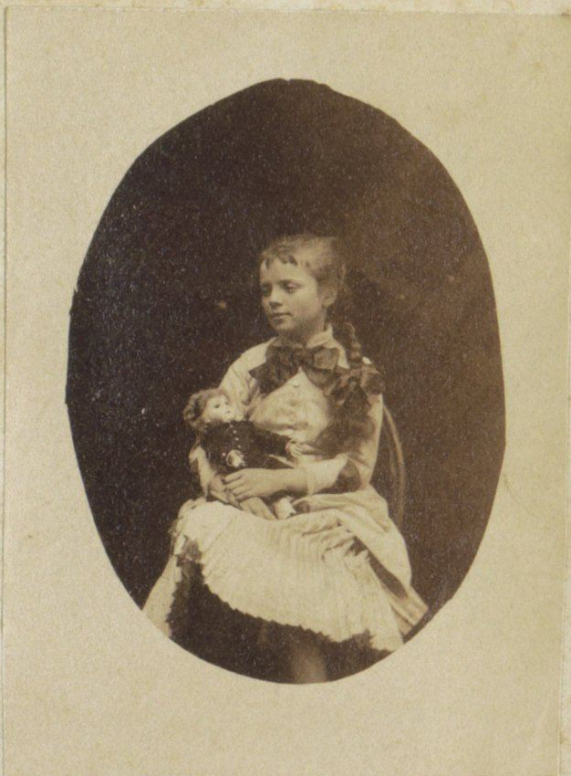 Portrait of child with doll